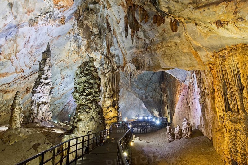 Boardwalk through illuminated dripstone cave