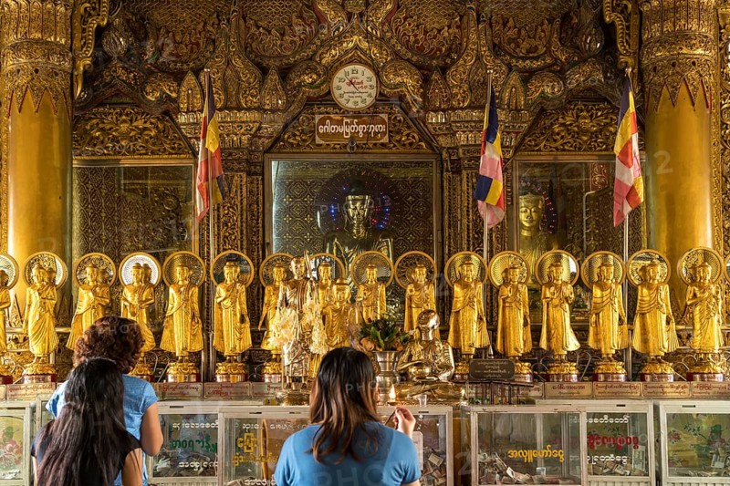 Praying Buddhists in the Sule Pagoda