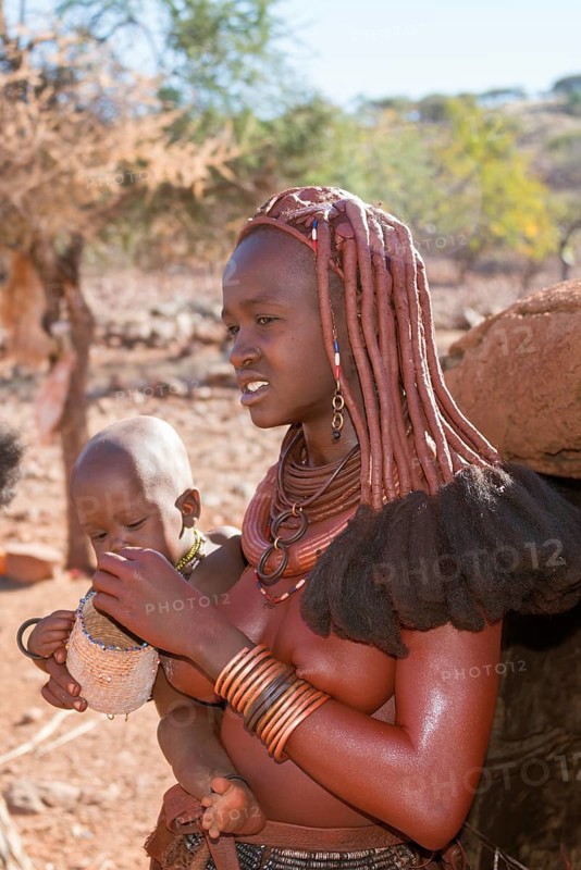 Himba woman with baby in arms
