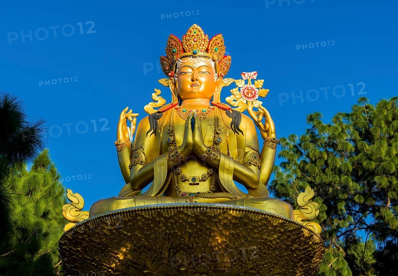 Big golden statue of Maitreya Buddha at back of Swayambhunath temple
