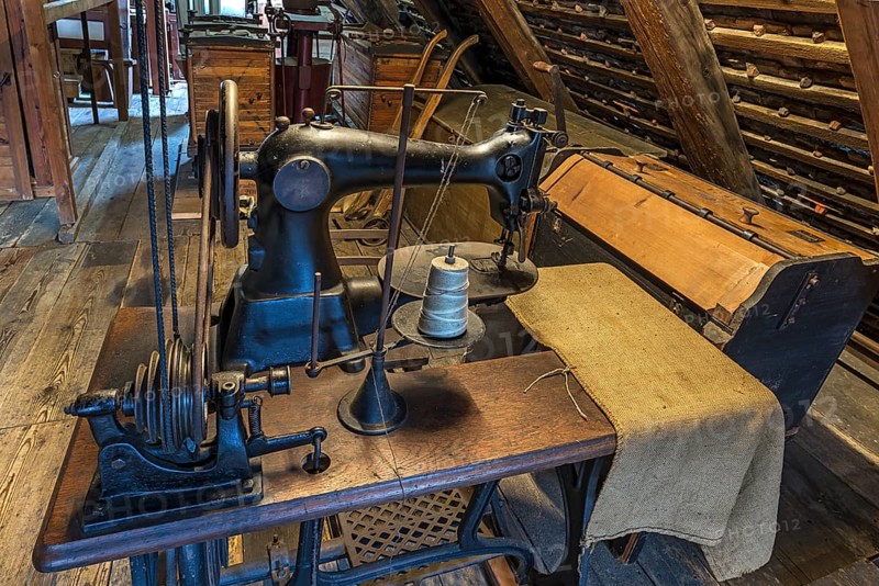 Old bag sewing machine for flour sacks in the attic of a mill