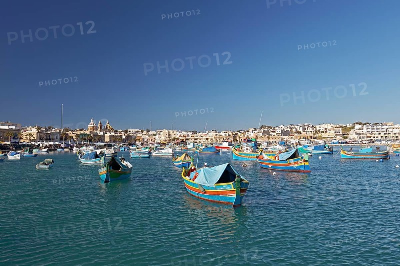 Cityscape with colorful fishing boats
