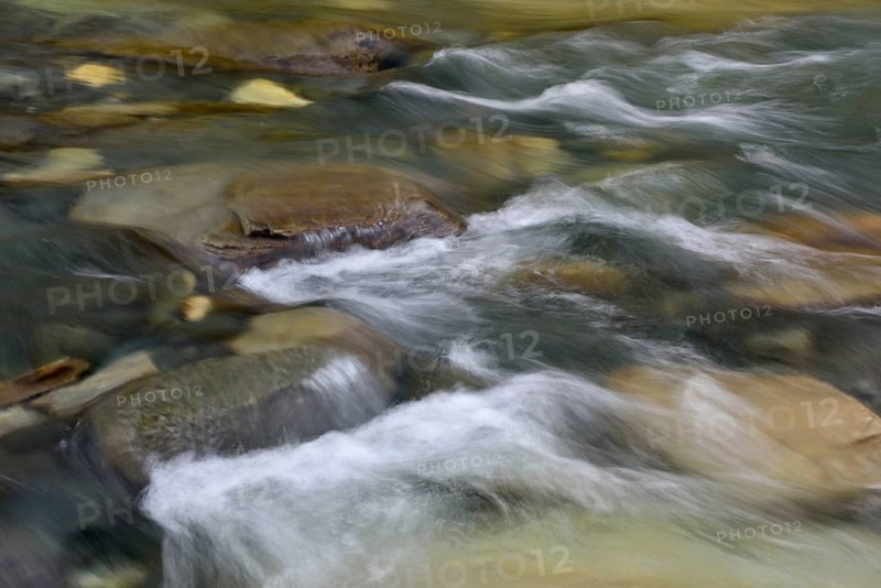 Water flows over stones