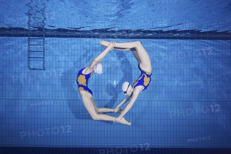 Underwater view of Synchronized Swimming in a swimming pool
