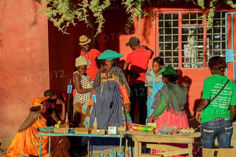 Locals in colorful clothes at a stall