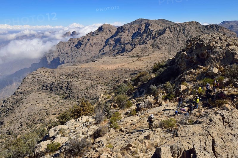 Tourists hiking in the Al Hajar al Gharbi mountains