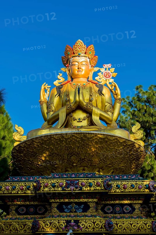 Big golden statue of Maitreya Buddha at back of Swayambhunath temple