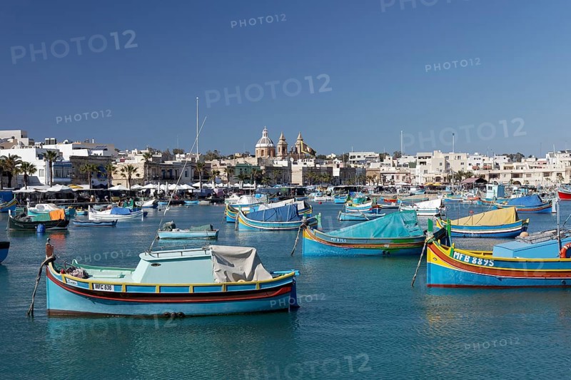 Cityscape with colorful fishing boats
