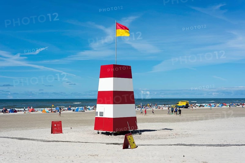 Guarded beach marked by flags