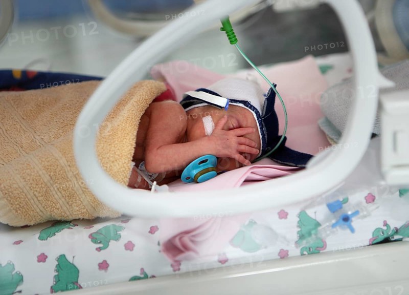Incubator with newborn baby