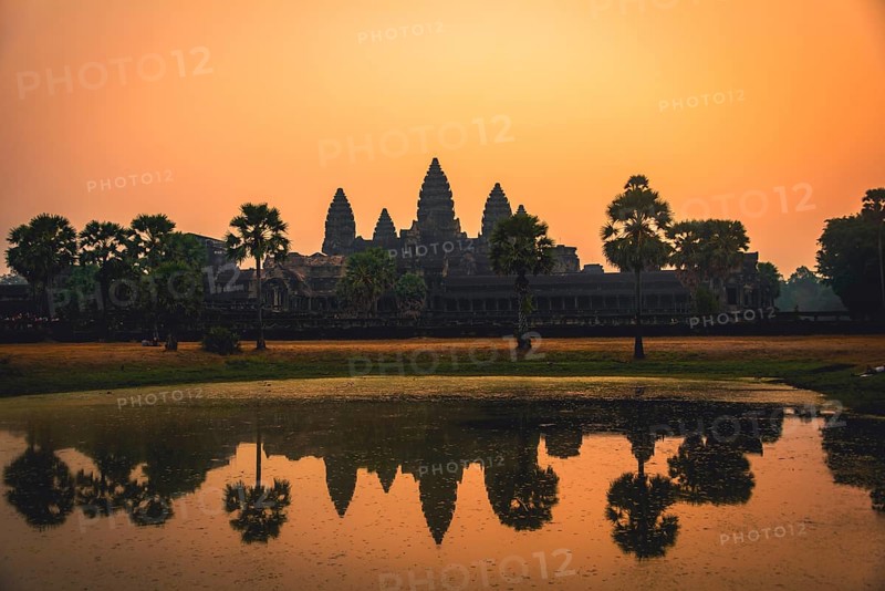 Temple complex of Angkor Wat reflected in the water basin