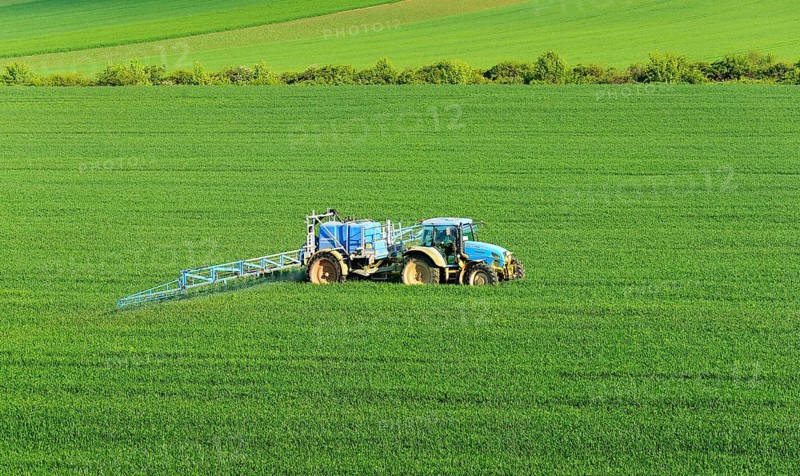 Tractor with field sprayer