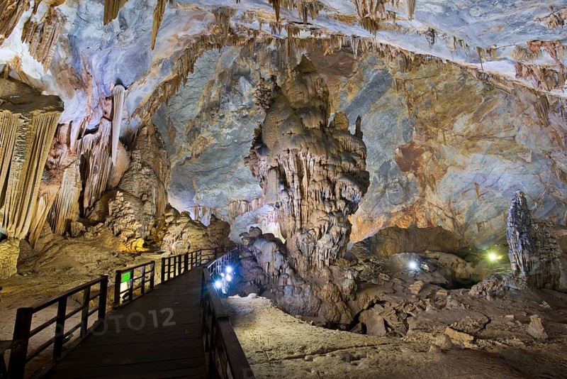 Boardwalk through illuminated dripstone cave