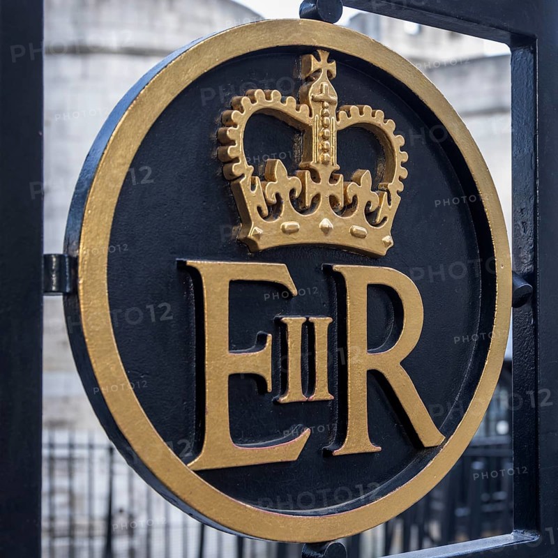 Sign of Queen Elizabeth II at a gate at the Tower of London