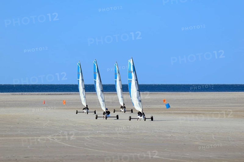 Sand sailors ride on the beach