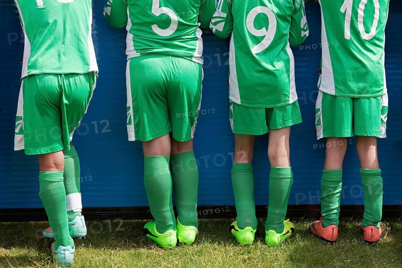 Four players of a youth football team