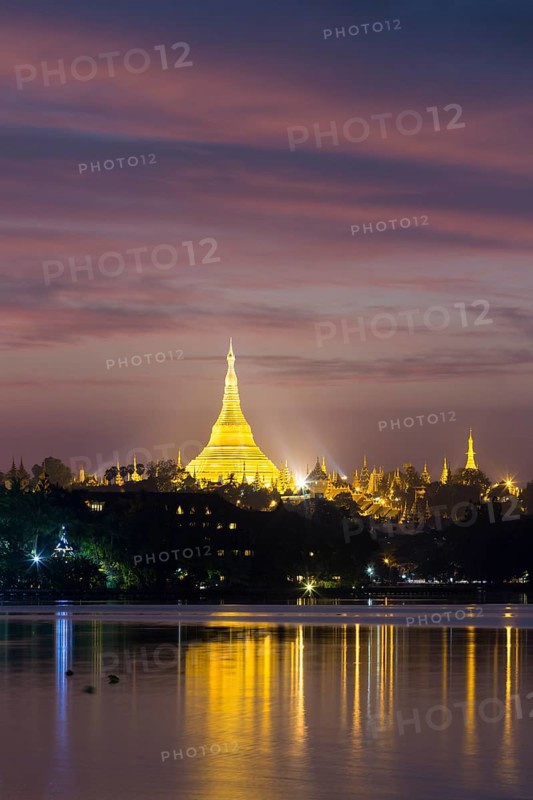 Illuminated Shwedagon Pagoda at sunset