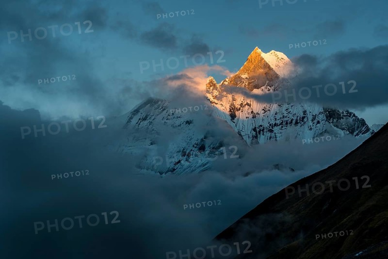 View on the summit of the mountain Machapuchare at sunset