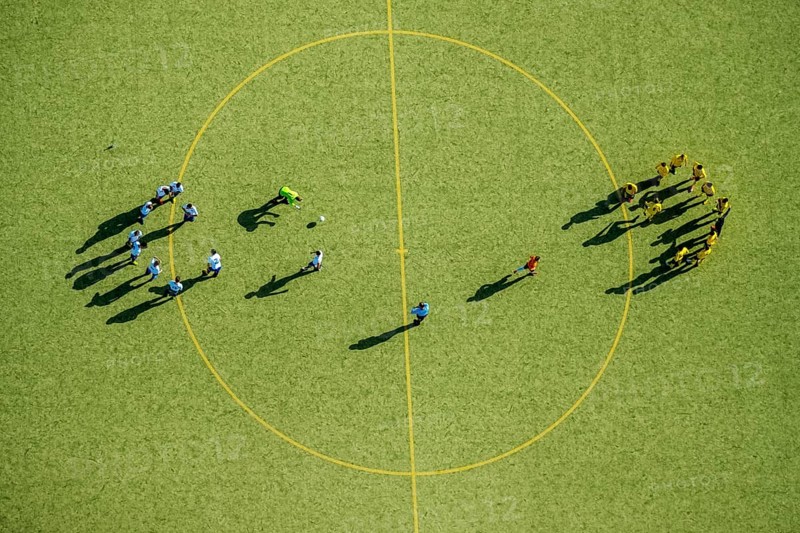 Football players at the center circle