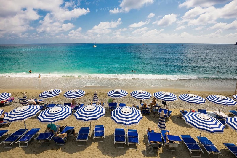 Sandy beach and colorful sunshades