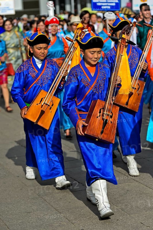 Youth in traditional Deel clothes and horse-head fiddle