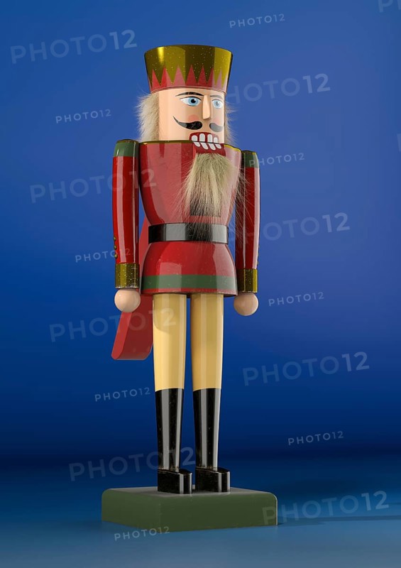 Nutcracker figure against a blue background