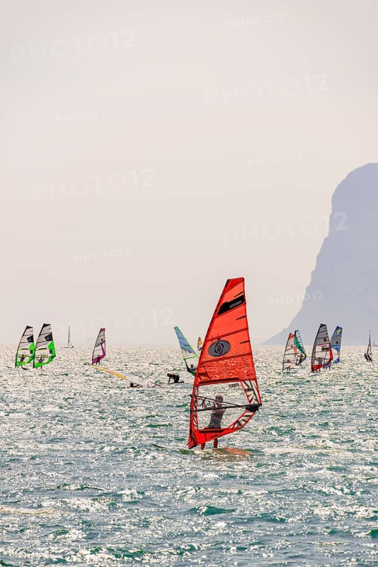 Many windsurfers with colourful sails