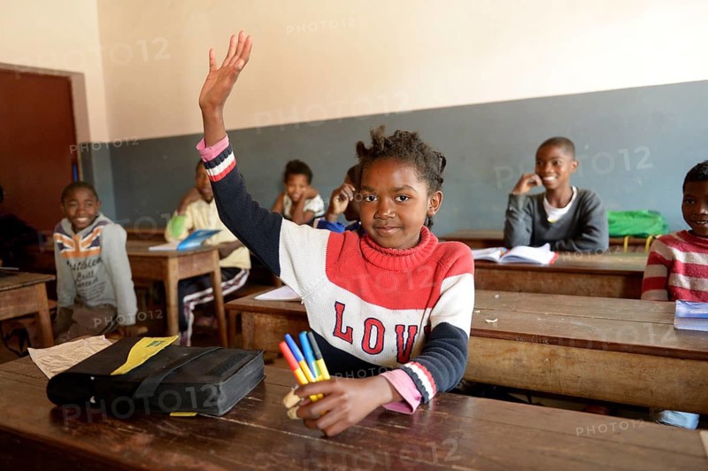 Girl with raised hand