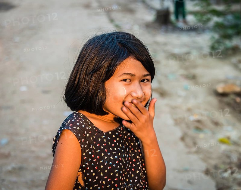 Little native girl smiling mischievously