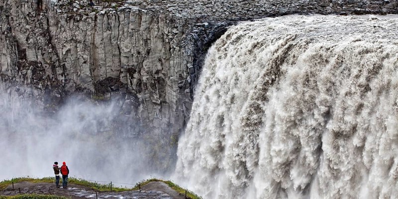 People at the waterfall Dettifoss