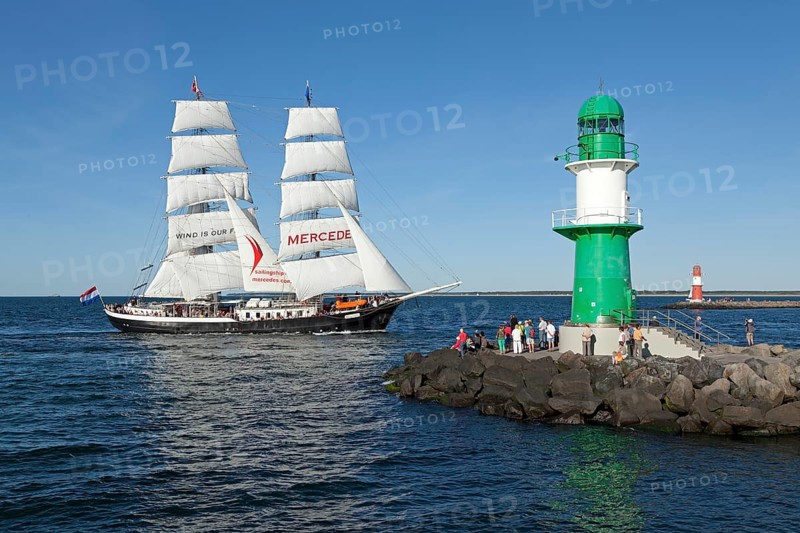 Lighthouse with sailing boat Mercedes at back