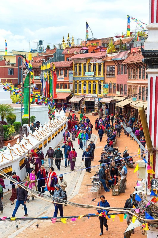 Buddhist pilgrims making the kora or ritual circumnavigation around the Boudhanath Stupa