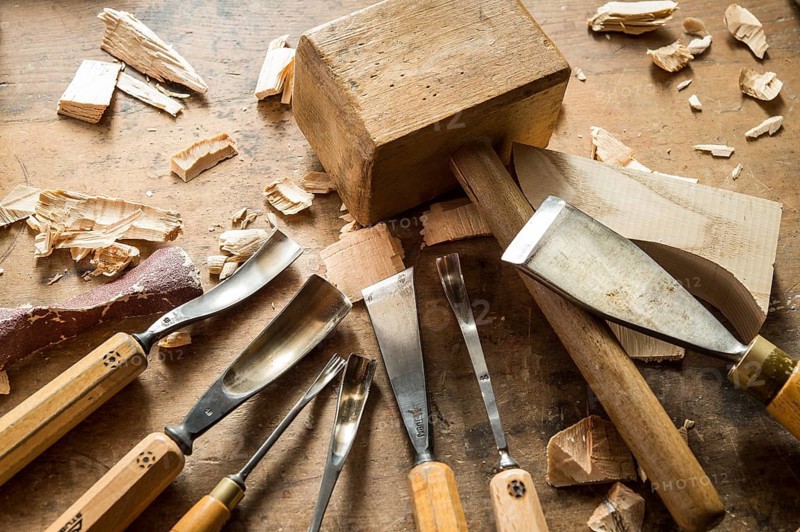 Various woodworking tools on a workbench