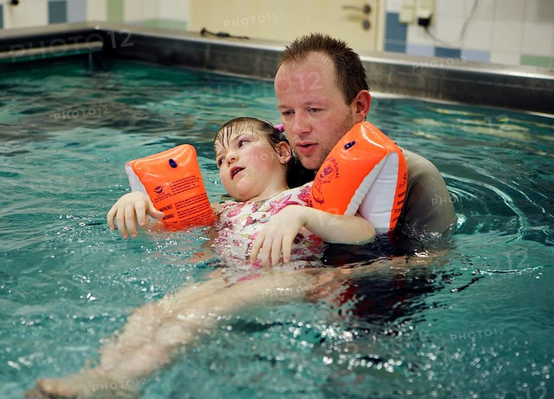 Physiotherapist during rehabilitation in the kinetotherapeutic bath