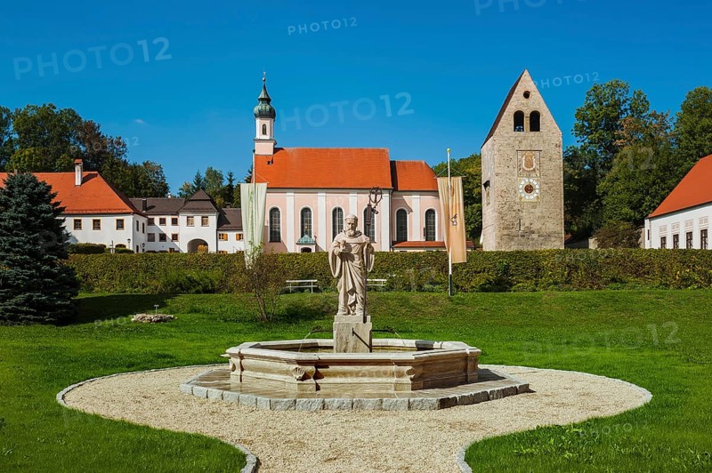 Monastery church with Roman tower and fountain with fountain figure of abbot Walto or Balto