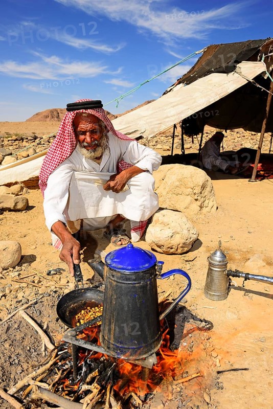Bedouin preparing coffee with pan-roasted beans and kardamom