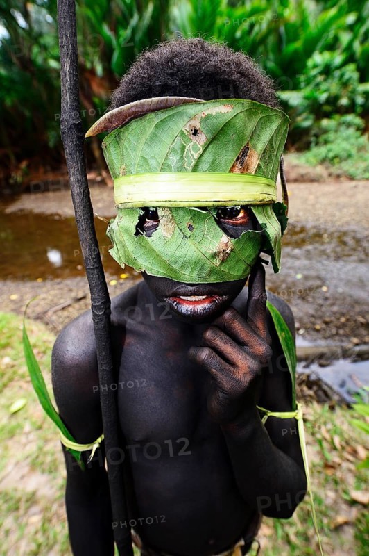 Korafe-child with facial and headdress made of leaves