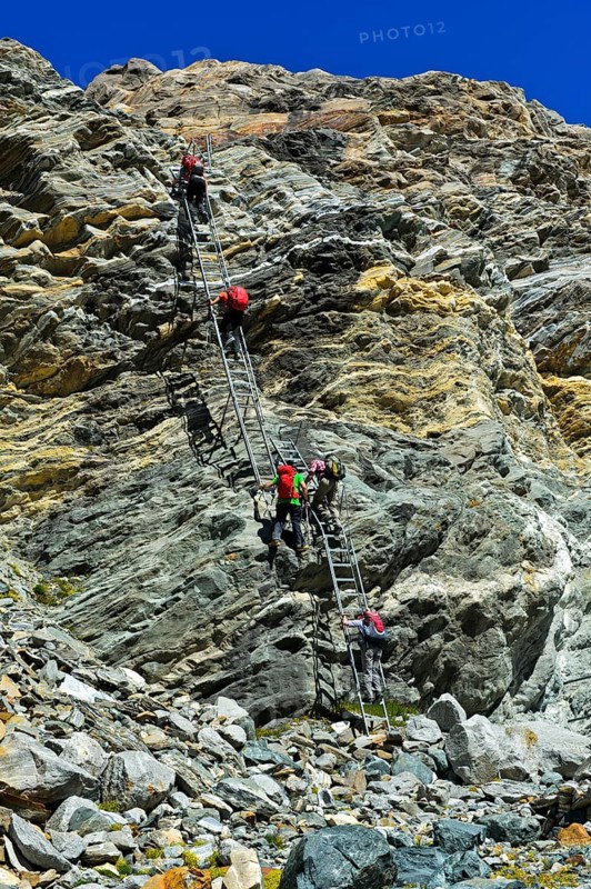 Alpine trail with metal ladders in the rock to the Monte Rosa hut