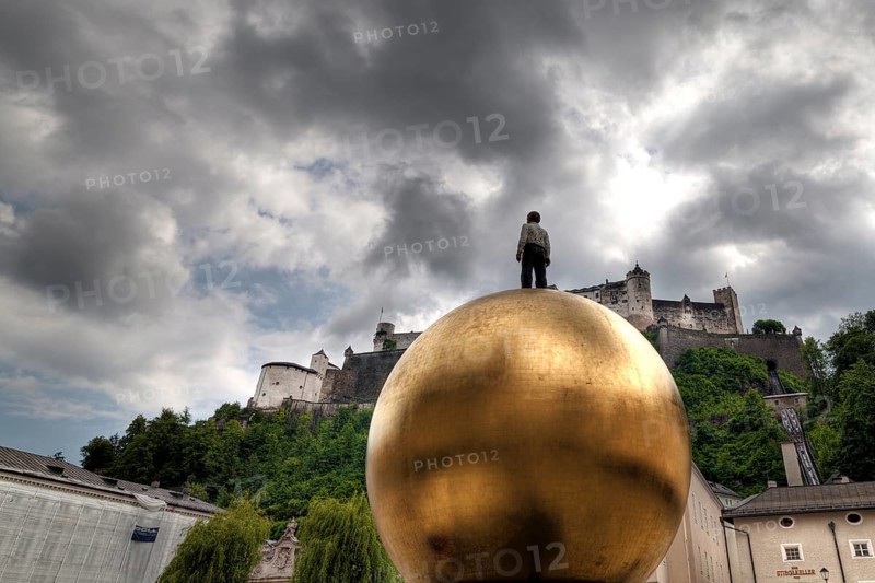 Man on a golden ball