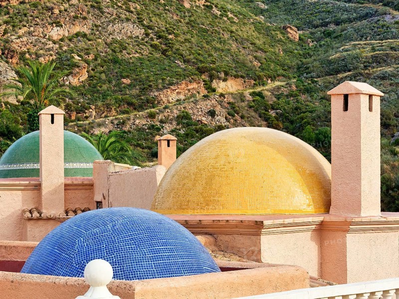Fireplaces and multicoloured domes on one roof