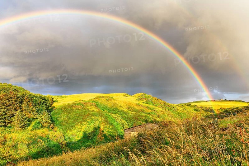 Double rainbow over landscape