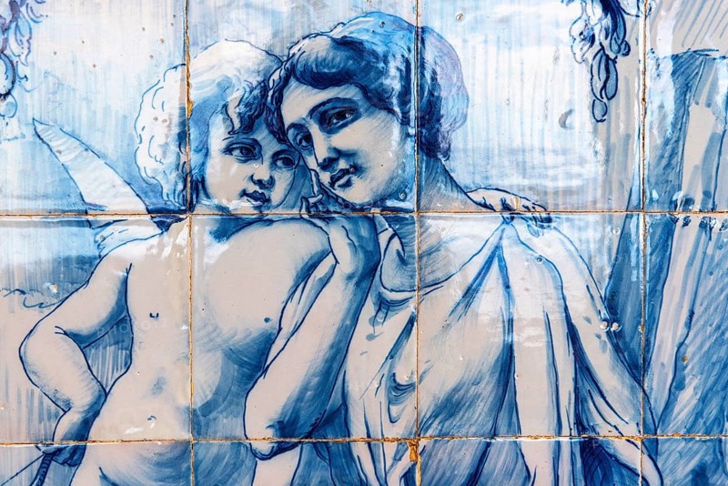 Angel embracing a young woman