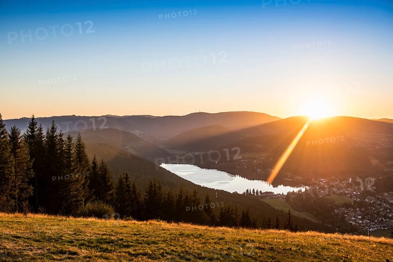 View from Hochfirst to Lake Titisee and Feldberg mountain at sunset