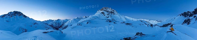 Panorama with tent and view of the mountain Kratzer in winter