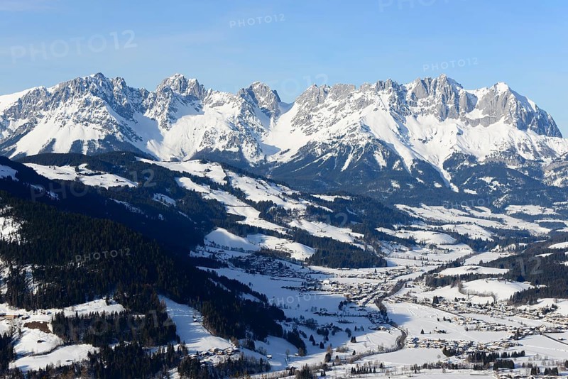 Snow-covered mountain massif Wilder Kaiser in winter with St. Johann in Tyrol