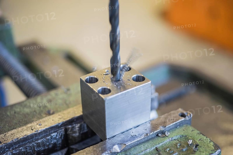 Drilling into a metal workpiece