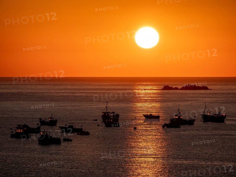 Fishing boats at sunset