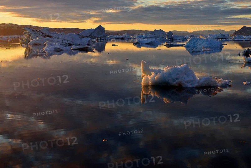 View over the icebergs at midnight sun