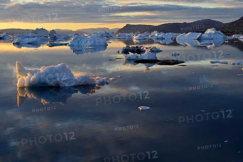View over the icebergs at midnight sun