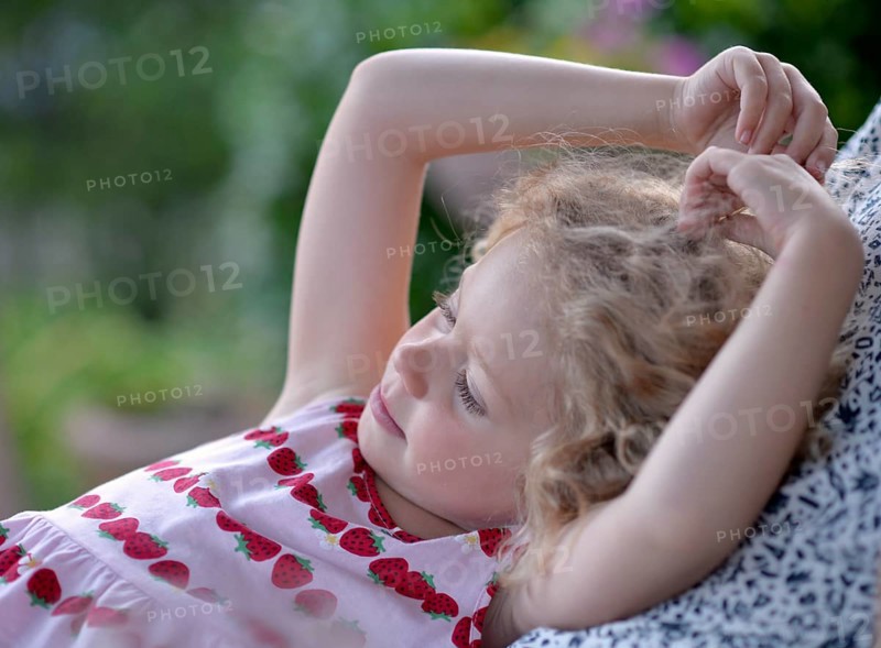 Young girl with blond curly hair